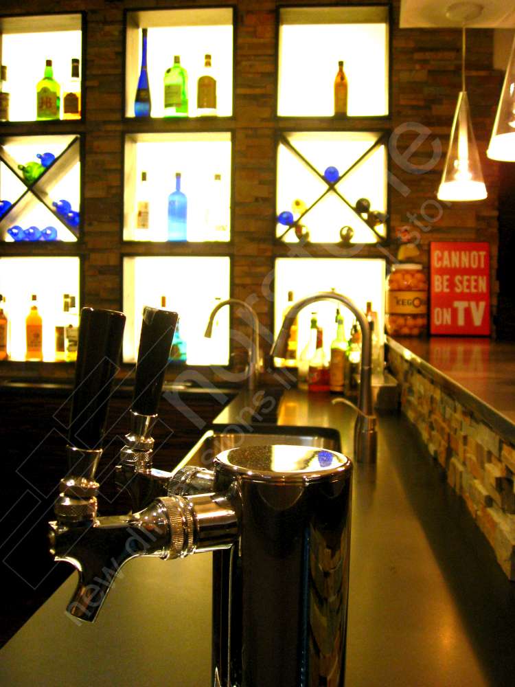 Norstone Stacked Stone Ochre Rock Panels used for accents on a basement bar